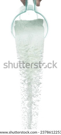 Detergent Powder splash fly in air. Detergent Powder pour from bowl lid cup. Detergent Powder blue soap explosion throw fluttering. White background isolated high speed shutter freeze motion