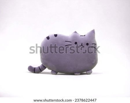 Cartoon gray cat doll on a white background