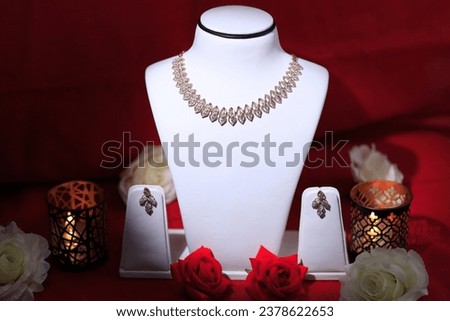 Traditional Heavy Indian Jewellery photography for theme of Navratri and diwali photographyin uses of white Neck and some flowers.