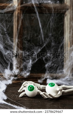 Halloween composition with skeleton and eyes, selective focus with shallow depth of field