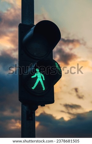 Pedestrian traffic light is on green, selective focus
