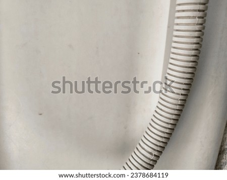 Flexible white washing machine drainage hose pipe