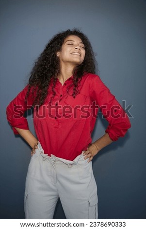 Close up view. Beautiful girl sincerely smiling on a gray background