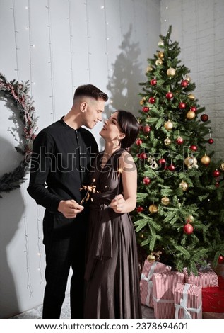 romantic couple in love happy about being together celebrating winter holidays in good mood