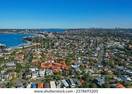 Panoramic drone aerial view over Freshwater, Queenscliff and Manly in the Northern Beaches area of Sydney NSW Australia, CBD in the distance.