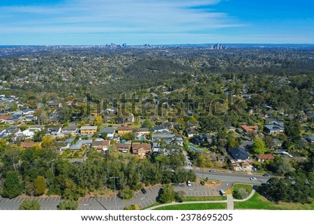 Panoramic drone aerial photo of a residential area in the Northern Beaches, with city in the distance, Sydney, Australia.