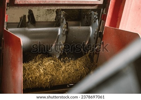 Herbage grass preparation with a grinding machine Royalty-Free Stock Photo #2378697061