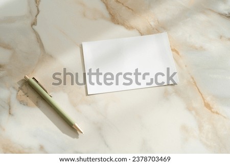 White paper blank on marble table
