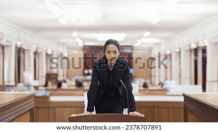 confidence lawyer woman talking in courtroom to Judge Making Passionate Speech to Judge, Jury and audience in court Royalty-Free Stock Photo #2378707891