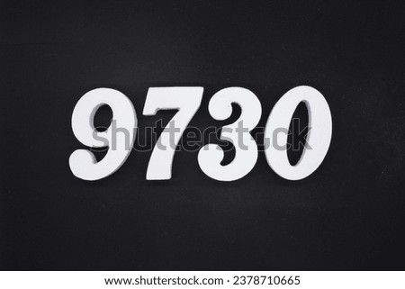 Black for the background. The number 9730 is made of white painted wood.