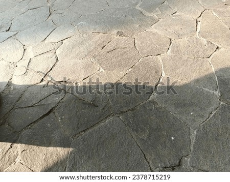 Beautiful pattern of natural stones design under afternoon sun ray. Image for mobile phone screen, display, wallpaper, screensaver, lock screen and home screen or background. 