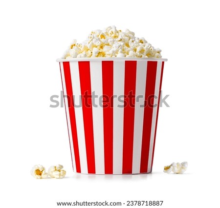 Popcorn in red and white striped bucket isolated on a white background Royalty-Free Stock Photo #2378718887