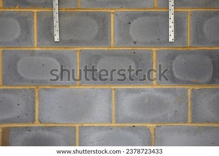 Breeze block wall  detail on a building site while renovating a house in London Royalty-Free Stock Photo #2378723433