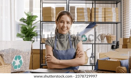 Go green use eco friendly packaging box in net zero waste store asian seller retail home office shop. Small SME owner young adult asia Gen Z people happy relax smile pride arm cross looking at camera. Royalty-Free Stock Photo #2378729997