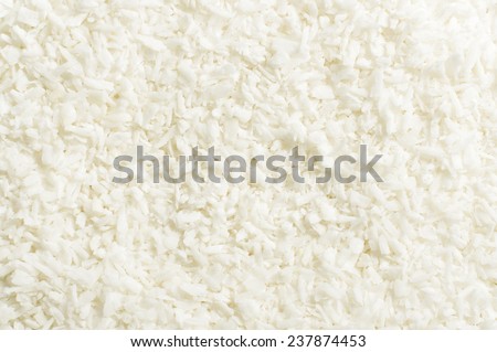 Shredded coconut shavings abstract texture background Royalty-Free Stock Photo #237874453