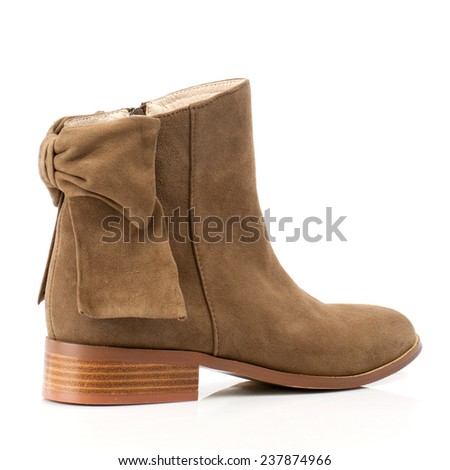 Brown suede boot isolated on white background.