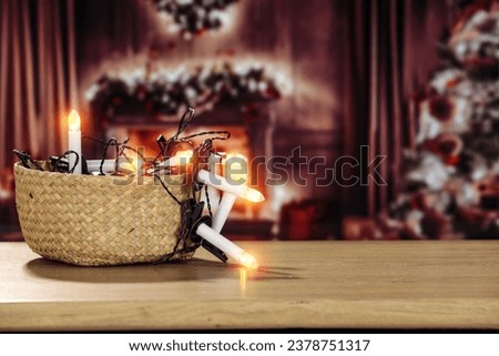 Christmas lights and christmas tree. Free space for your decoration and warm home interior. Empty space for your products. Mockup background of desk and natural lights. 