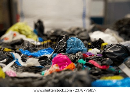 Stack of plastic residual mix waste in a plastic recycling factory Royalty-Free Stock Photo #2378776859
