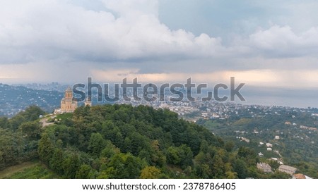 Batumi in the fall in the rain. Batumi in September. View of the city of Batumi from Mount Sameba. City landscape with beautiful clouds during the rain and sunset. Aerial View of Batumi by Drone