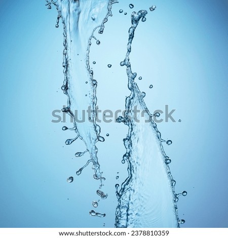 Water splash against a blue background