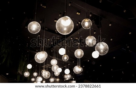 glowing hanging light bulbs. Beautiful modern ceiling lamps Royalty-Free Stock Photo #2378822661