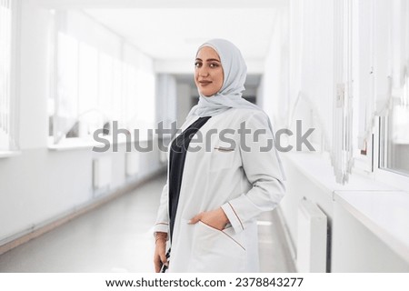 Portrait of a beautiful young female doctor Royalty-Free Stock Photo #2378843277