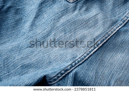 Jeans Fabric Pattern Background: Jeans Background Image Creating a background picture with a fabric pattern for jeans can add a unique and stylish touch to your design. Here's Royalty-Free Stock Photo #2378851811