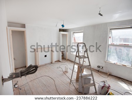 Repairs in the apartment. Wallpapering in the room. Royalty-Free Stock Photo #237886222