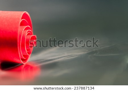 Macro, abstract, background picture of red paper spirals with reflections 
