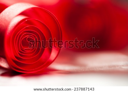 Macro, abstract, background picture of red paper spirals with reflections 