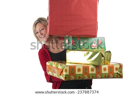Happy middle aged woman holding a lot of presents against a white background