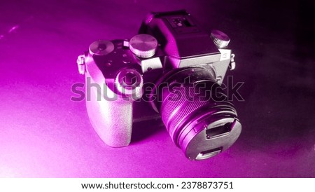 mirrorless camera with purple light from the left side. Surabaya, East Java, Indonesia. January 07, 2023