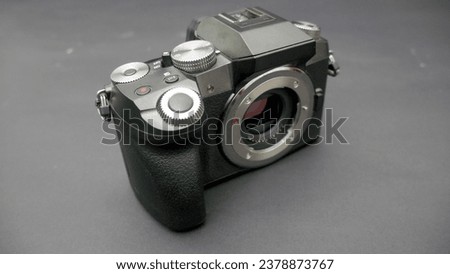 mirrorless camera without lens in black background. Surabaya, East Java, Indonesia. January 07, 2023