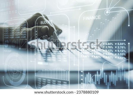 Abstract creative stats data concept with hands typing on laptop on background. Multiexposure