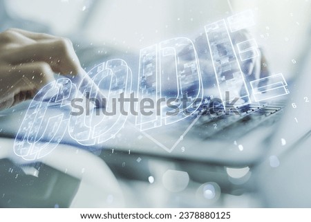Creative Code word sign and hands typing on laptop on background, international software development concept. Multiexposure