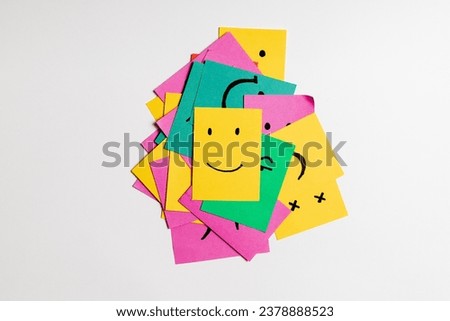 Mixed smileys on sticky notes, white background