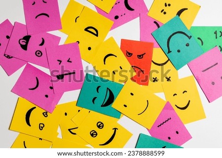 Mixed smileys on sticky notes, white background