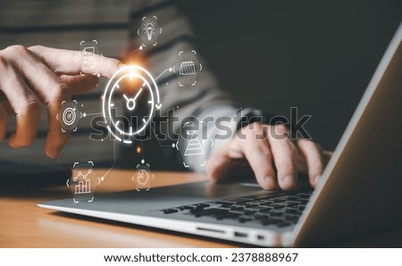 Business person with time management activity to improve productivity, process optimization and lean organization. Business and production improvement by time and resource planning for more profit. Royalty-Free Stock Photo #2378888967