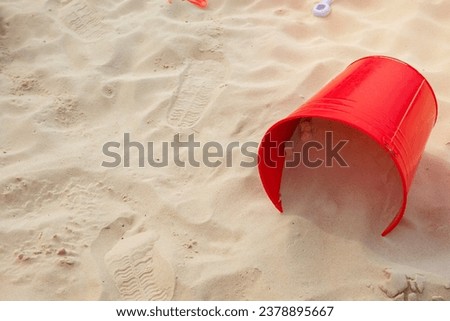 Sand bucket at the seabeach with space for text summer fun at sea concept