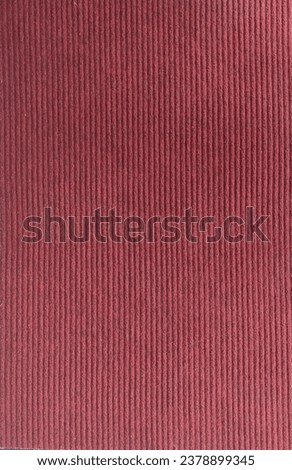 A red doormat with all matching plane lines in the picture.