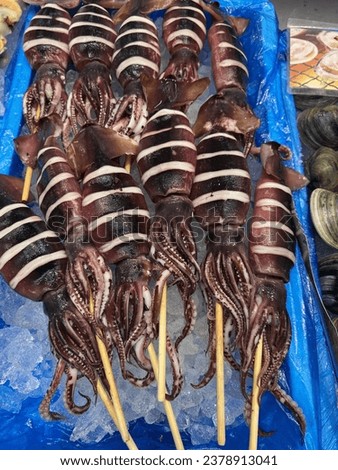 Closed Up Picture Of Squid Skewers.