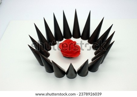 Elongated chocolates are located on white background