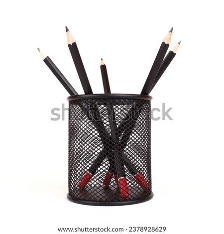 Black pencils in black penholder isolated on white background Royalty-Free Stock Photo #2378928629