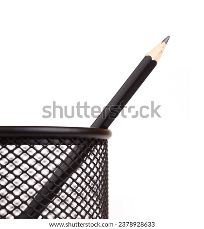 Black pencil in black penholder isolated on white background Royalty-Free Stock Photo #2378928633
