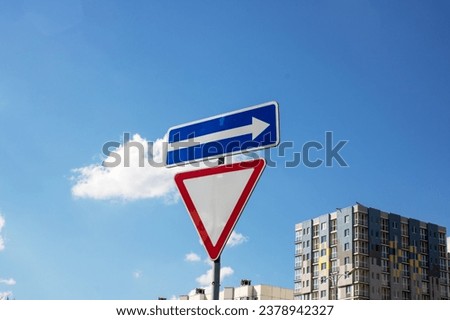 Secondary road road sign and arrows close up