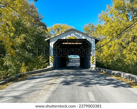 A covered bridge in October