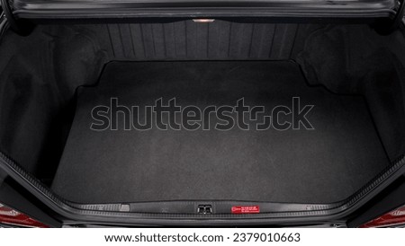 Inside of a car trunk showing the carpet Royalty-Free Stock Photo #2379010663