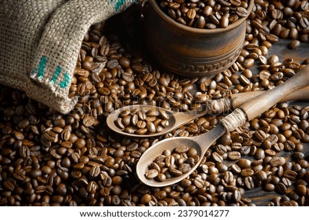 Coffee beans on old background with accessories.