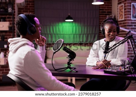Online show host interviewing celebrity guest during live broadcast for streaming service website, talking about her life. Internet talking show interviewer using professional tools to record podcast