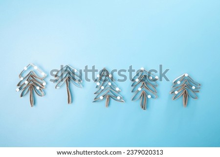 paper Christmas tree craft, recycled concept Royalty-Free Stock Photo #2379020313